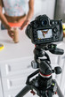 © LIGHTFIELD STUDIOS - selective focus of digital camera with woman gesturing near glass with smoothie on screen