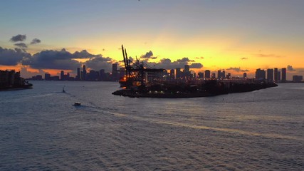 Wall Mural - Port Miami aerial inspire shot 4k sunset cranes in motion