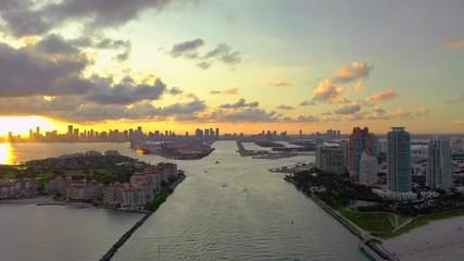 Wall Mural - Aerial video between Miami Beach Inlet approach port at sunset 4k
