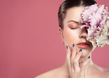 Beautiful Young Woman With Makeup In Gentle Colors Holds A Big Pink Flower, Beauty Concept