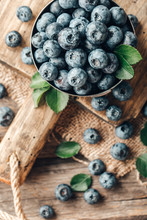 Freshly Picked Blueberries In Bowl On Wooden Background. Healthy Eating And Nutrition.