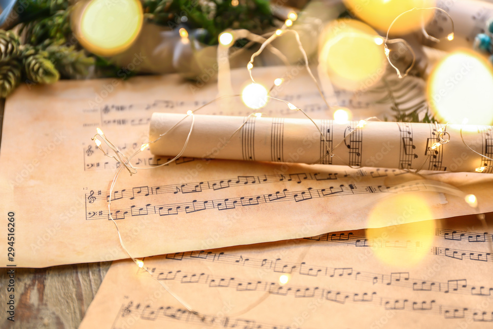 Christmas composition with music notes on table
