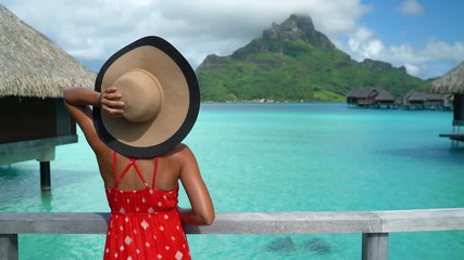 Wall Mural - Bora Bora Vacation Travel woman walking on paradise motu beach on holidays on French Polynesia with Mount Otemanu. Happy girl on luxury travel in overwater bungalow resort hotel in Tahiti.