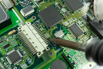 soldering iron for repairing electronic of the computer circuit board concept technology of computer circuit hardware