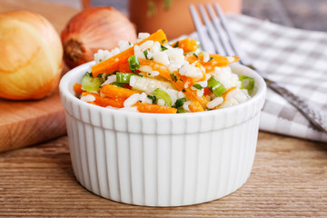 Poster - Boiled rice with vegetables in a white ribbed bowl.