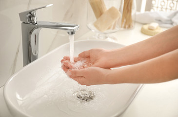 Wall Mural - Woman washing hands indoors, closeup. Bathroom interior