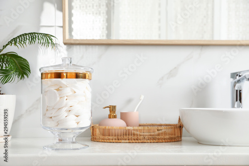 Cuadros en Lienzo Jar with cotton pads on bathroom countertop