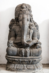 Ancient stone statue of the elephant god Ganesha (aka Ganapati, Vinayaka) in Indonesia