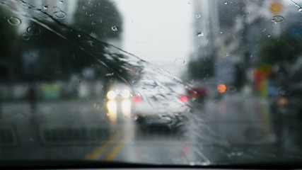 Wall Mural - driving car rainy day in downtown