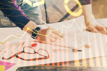 Multi exposure of man standing and planing investment with stock market forex chart.