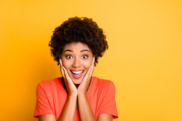 Poster - Close up photo of cheerful cute charming attractive girlfriend black smiling toothily holding her cheeks with hands isolated over yellow vivid color background