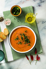 Wall Mural - cream soup of red lentils with tomatoes on the table. healthy vegan warming food for the whole family