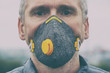 © Monika Wisniewska - Man wearing a real anti-pollution, anti-smog and viruses face mask
