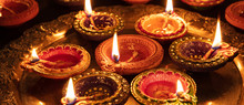 Diwali, Hindu Festival Of Lights Celebration. Diya Oil Lamps Against Dark Background,