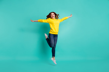 Canvas Print - Full length body size photo of cheerful cute nice curly wavy fascinating girl wearing jeans denim excited facial expression isolated over vivid turquoise color background