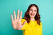 Photo of sweet pretty cute nice cheerful charming curly wavy white youngster willing to give you high five smiling beaming toothily isolated turquoise color background