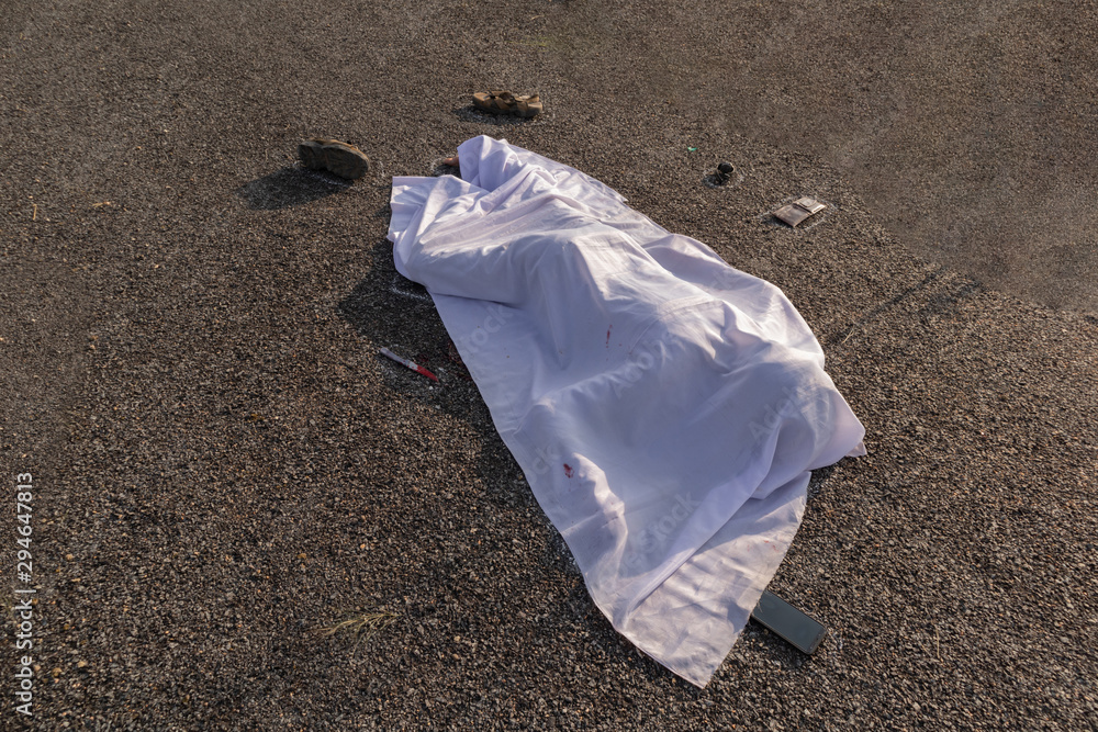 Photo Stock Concept of crime murder scene, High angle view of chalk  outlined death body with bllody knife under white cloth on road. | Adobe  Stock