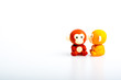 Two monkey rubber toys, cute animal shaped rubber doll isolated in white background. Toys for children.