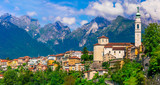 Fototapeta  - Travel in northern Italy - beautiful Belluno town surrounded by impressive Dolomite mountains