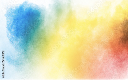Colorful background of pastel powder explosion.Multi colored dust splash on w...