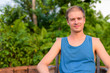 © Ranta Images - Young handsome man with blond hair relaxing outdoors