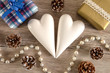 two decorative hearts and two christmas presents on a table
