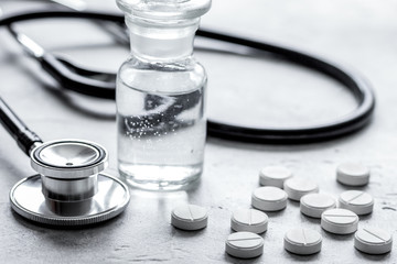 doctor's instruments and pills in medical set on white background