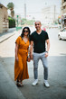 © Shannon Selim/Stocksy - Couple walking through Cairo