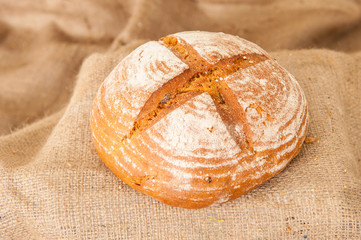 white bread on burlap background