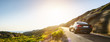 canvas print picture - rental car in spain mountain landscape road at sunset