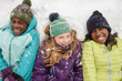 © Gabriel (Gabi) Bucataru/Stocksy - Giggling Friends in Snow