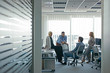 © Lumina/Stocksy - Group of Businesspeople Having a Meeting