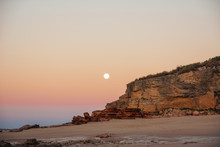 Full Moon Rising Over Red Cliffs