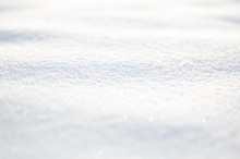 White Snow Wavy Surface Close Up And Flakes Background