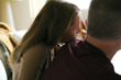 © Rob and Julia Campbell/Stocksy - Serious couple leaning on each other at home.