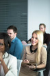 © Lumina/Stocksy - Businesswoman Attending the Conference