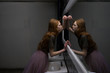 © Vyacheslav Chistyakov/Tetra Images - Young woman leaning on bathroom mirror