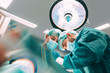 © MyMicrostock/Stocksy - Surgeons in the operating room