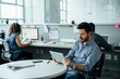 © FS Productions/Tetra Images - Man using digital tablet in office