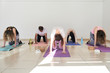 © Ivan Gener/Stocksy - Group yoga class abdomen.