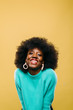 © Marc Bordons/Stocksy - Young afro hairstyle woman.