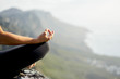 © Micky Wiswedel/Stocksy - closeup of a female hand in a meditative pose outdoors