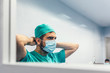 © MyMicrostock/Stocksy - Doctor Covering His Face With Mask