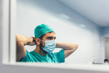 Doctor Covering His Face With Mask