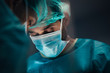© MyMicrostock/Stocksy - Surgeons in the operating room