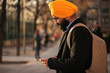 © Santi Nunez/Stocksy - Young handsome Indian Sikh in the street