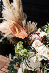 Wall Mural - Bridal bouquet with calla lilies and peonies in boho style