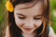 © Cavan Images - Close up portrait of little girl with eyes closed and smiling