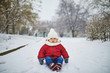 © Ekaterina Pokrovsky - Happy smiling baby girl sitting in snow