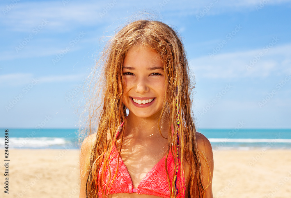 Smiling long hair blond girl on the beach Stock Photo | Adobe Stock